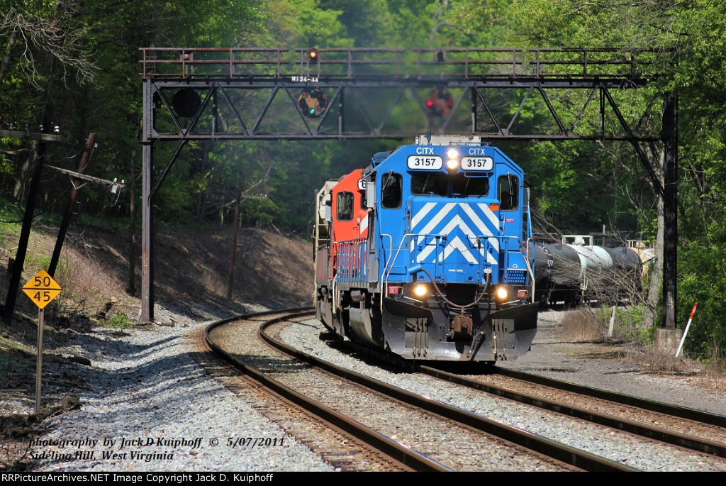 CITX SD40-2 3157 - CP 6214, with eastbound K674 passing under the ex-B&O CPLs mp W134, Sideling Hill, West Virginia. May 7, 2011.